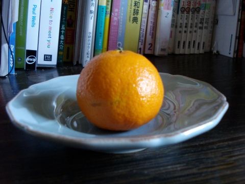 Clementine on a blue plate